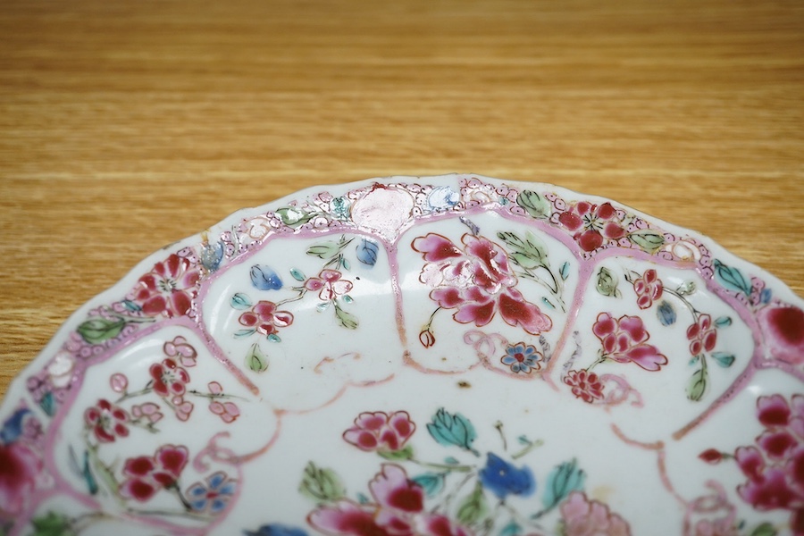 A Chinese famille rose moulded saucer dish, Yongzheng/Qianlong, 16cm in diameter. Condition - fair